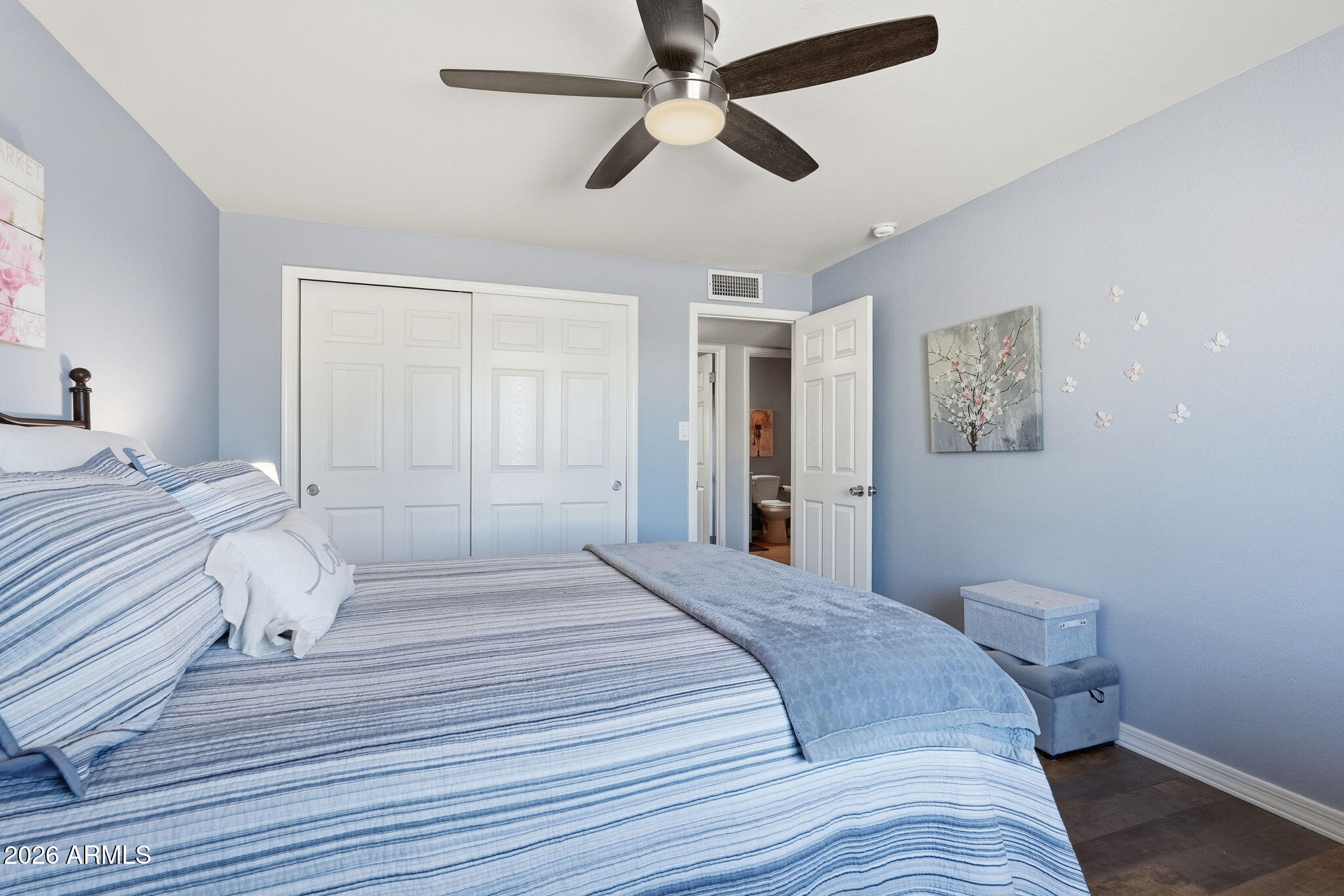 3765 East Pershing Avenue Phoenix, AZ 85032 - Photo 25 of 48 a bedroom with a bed and a ceiling fan