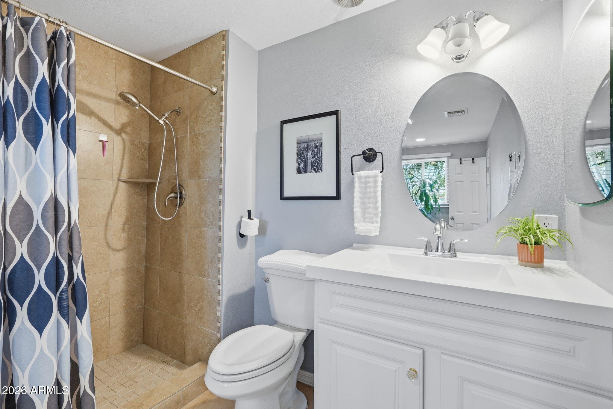 3765 East Pershing Avenue Phoenix, AZ 85032 - Photo 27 of 48 a bathroom with a sink toilet and shower