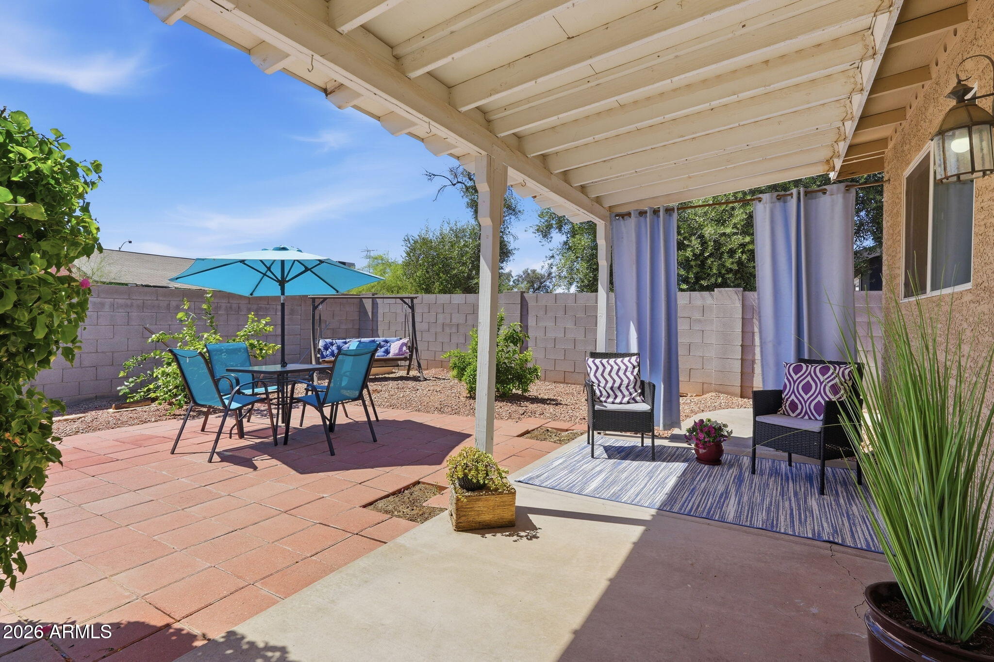 3765 East Pershing Avenue Phoenix, AZ 85032 - Photo 29 of 48 a building outdoor space with patio furniture and potted plants