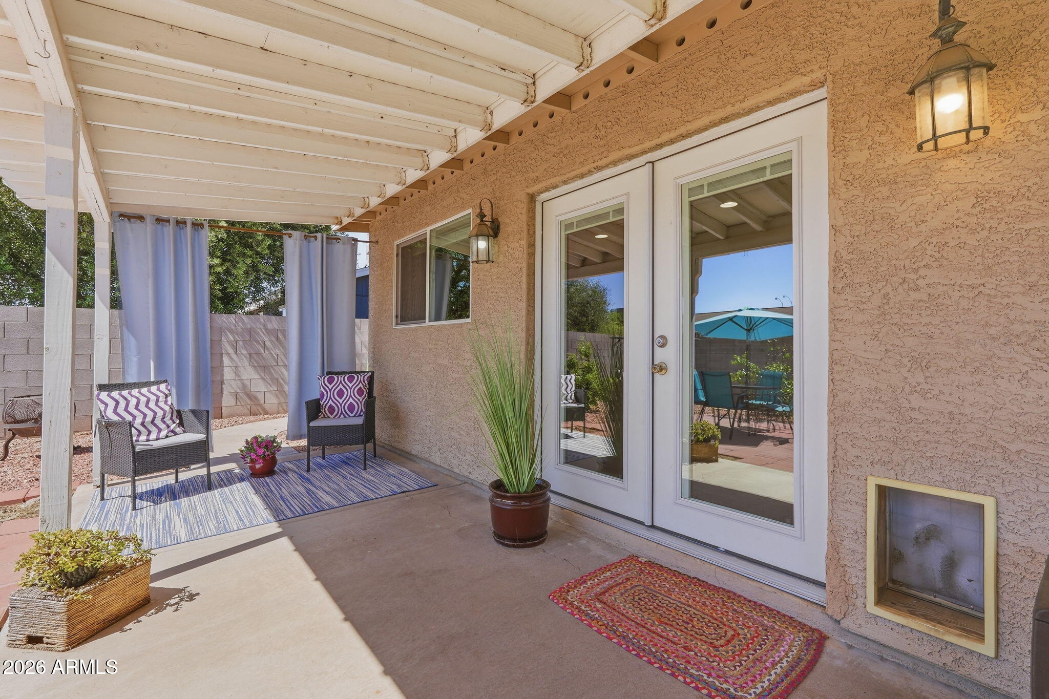 3765 East Pershing Avenue Phoenix, AZ 85032 - Photo 30 of 48 a view of an outdoor space with porch and wooden floor