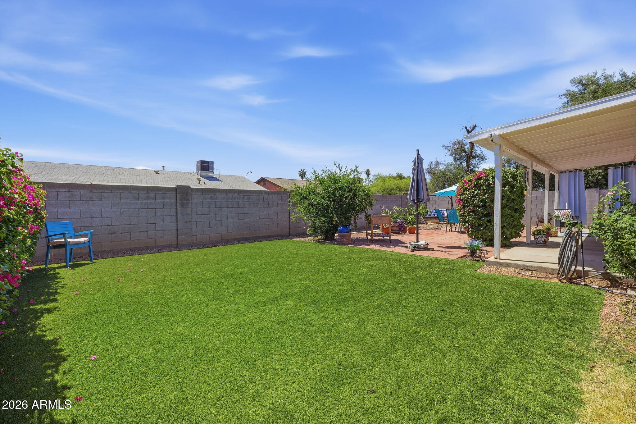 3765 East Pershing Avenue Phoenix, AZ 85032 - Photo 34 of 48 a view of a backyard with plants and outdoor seating
