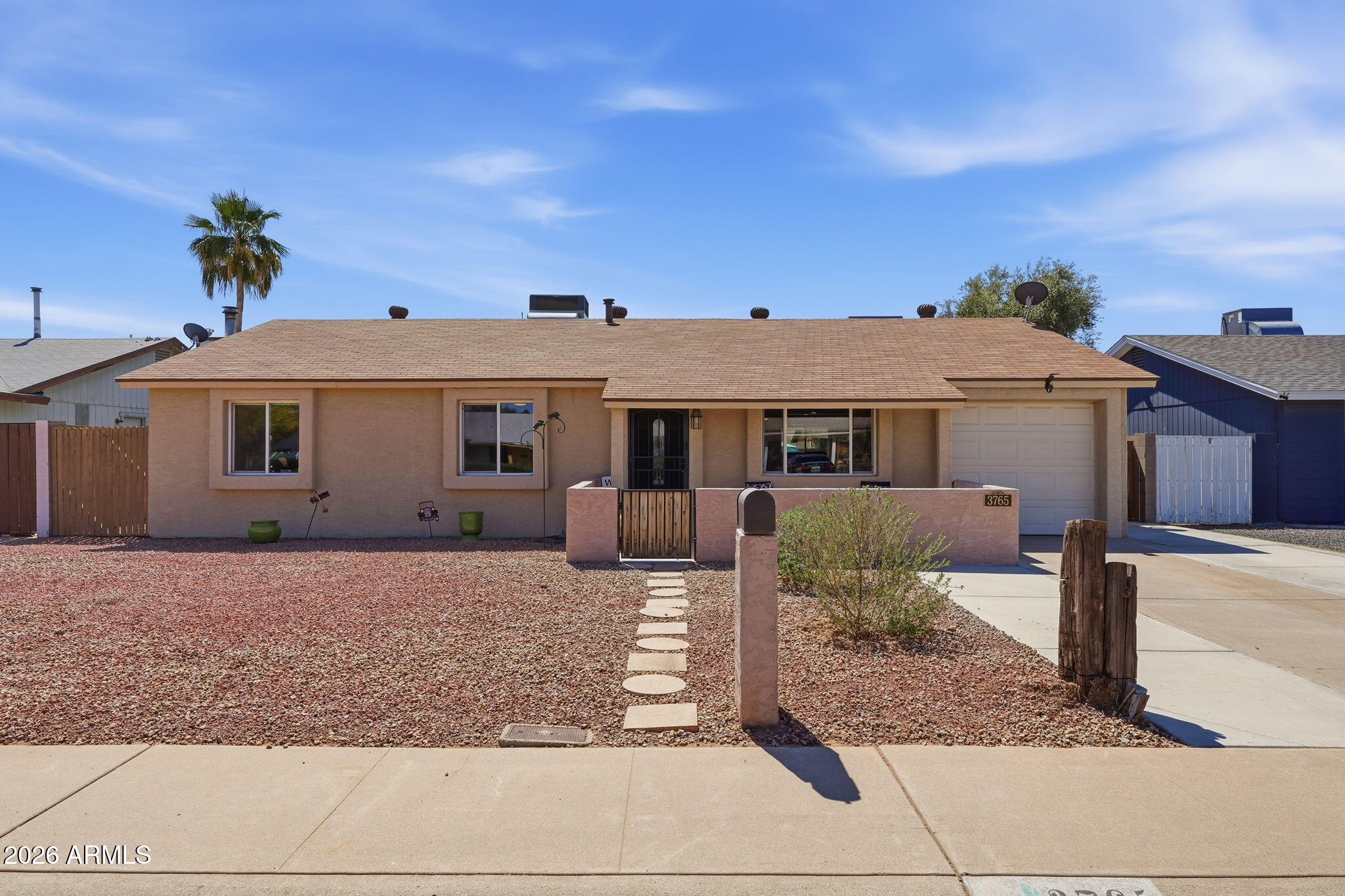 3765 East Pershing Avenue Phoenix, AZ 85032 - Photo 37 of 48 a front view of a house with a yard