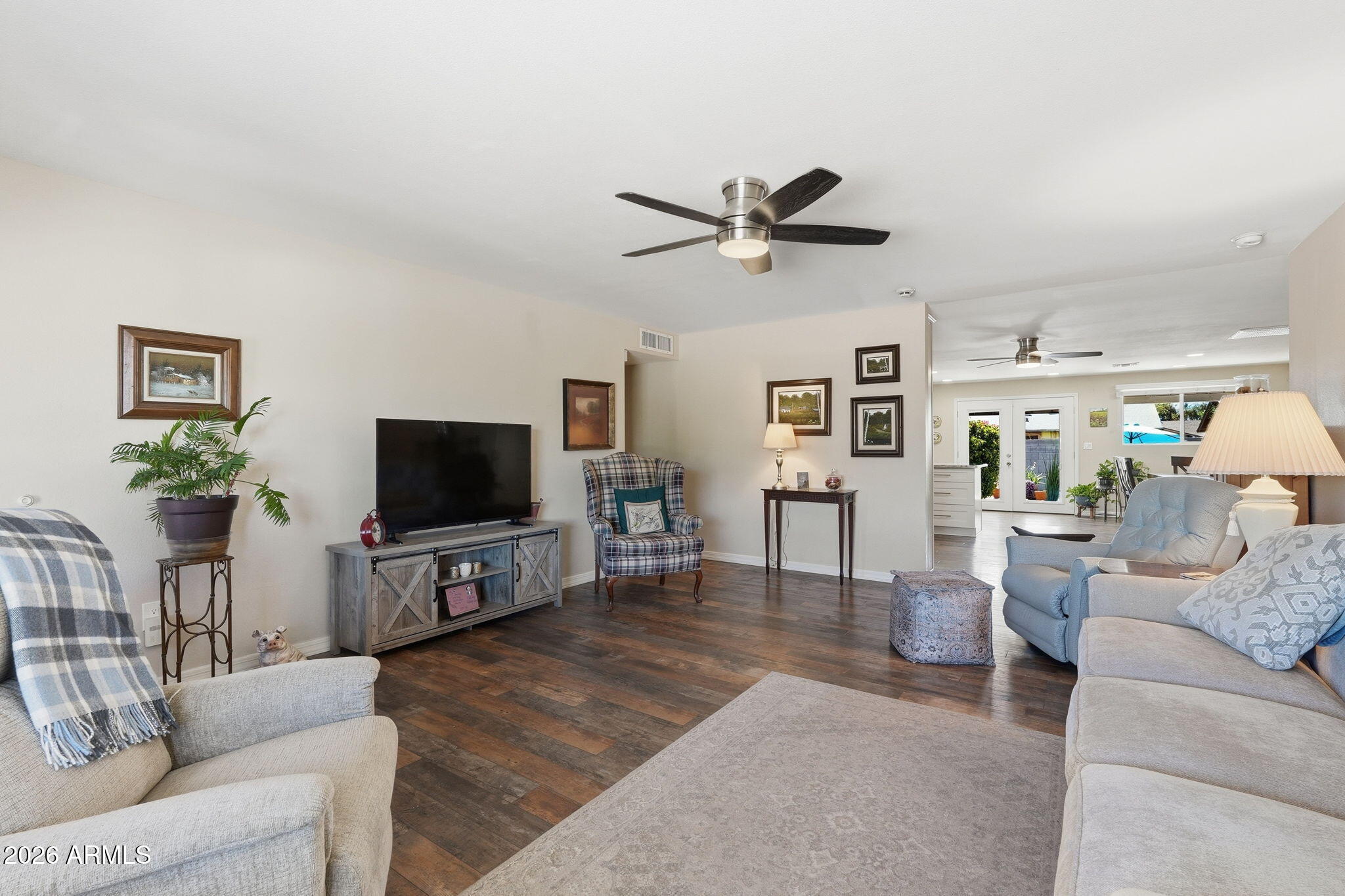 3765 East Pershing Avenue Phoenix, AZ 85032 - Photo 4 of 48 a living room with furniture and a flat screen tv