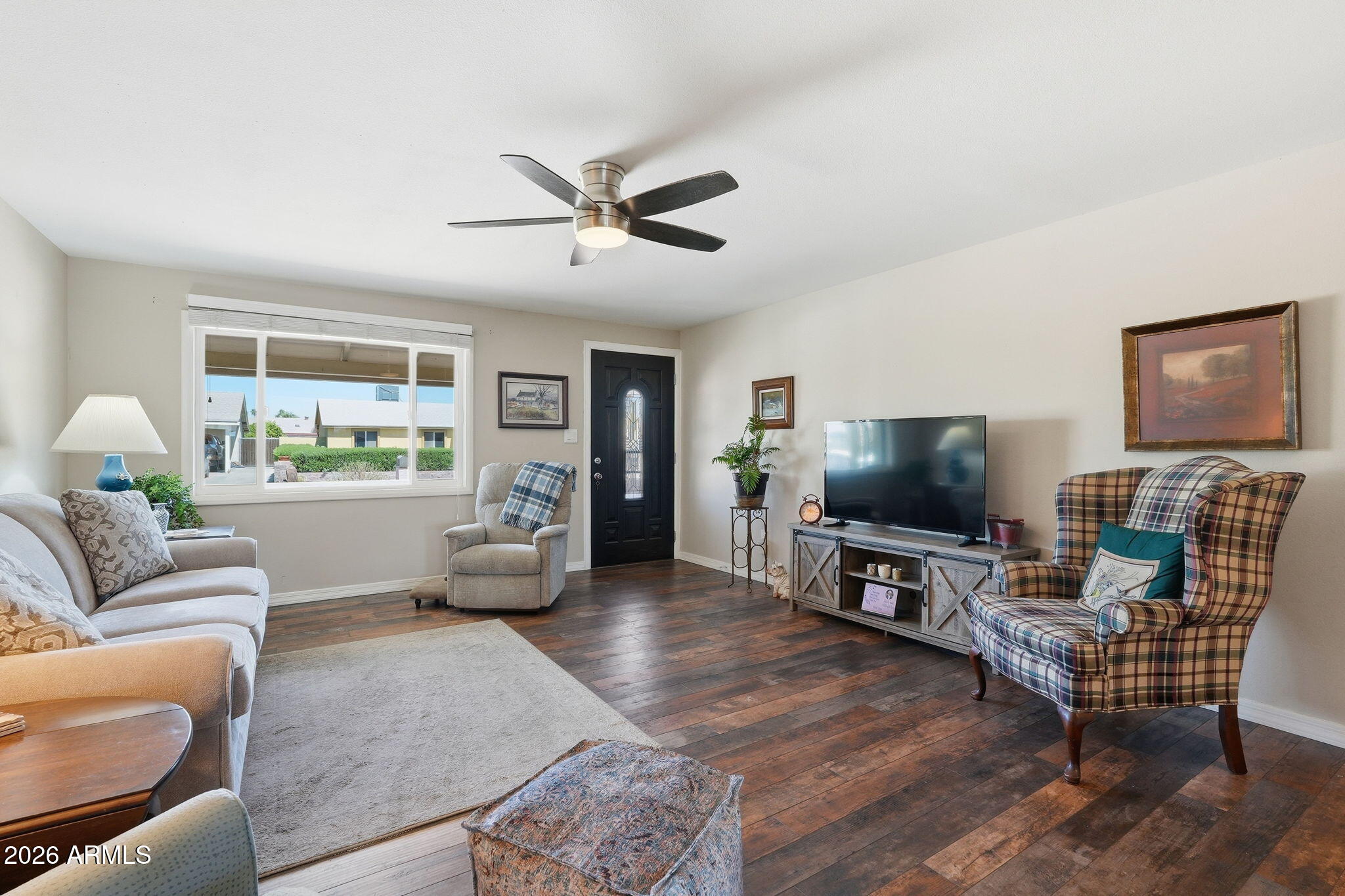 3765 East Pershing Avenue Phoenix, AZ 85032 - Photo 5 of 48 a living room with furniture and a flat screen tv