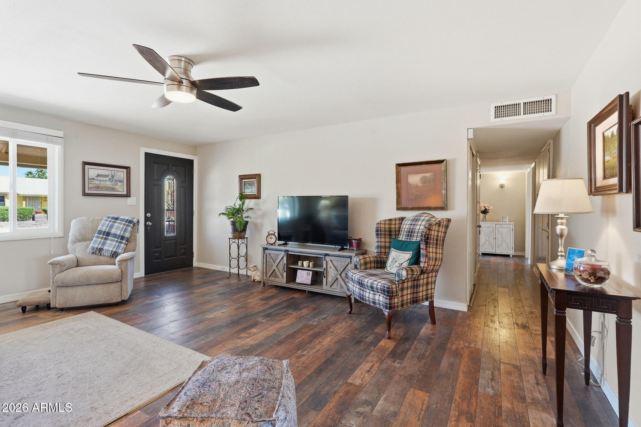 3765 East Pershing Avenue Phoenix, AZ 85032 - Photo 6 of 48 a living room with furniture and a flat screen tv
