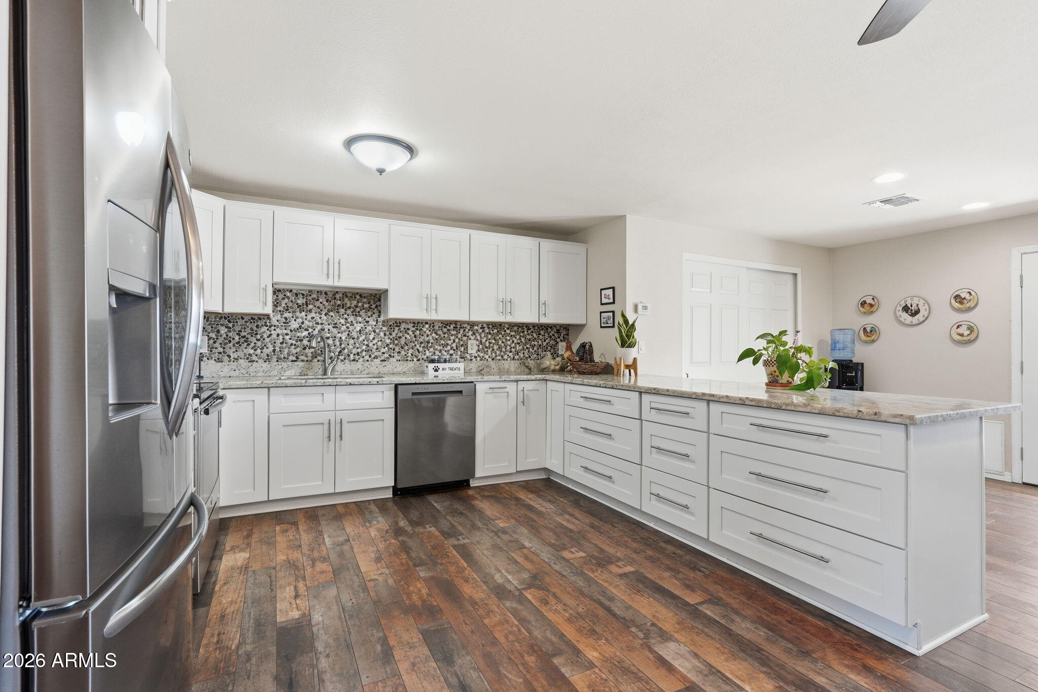 3765 East Pershing Avenue Phoenix, AZ 85032 - Photo 9 of 48 a kitchen with granite countertop white cabinets and white appliances