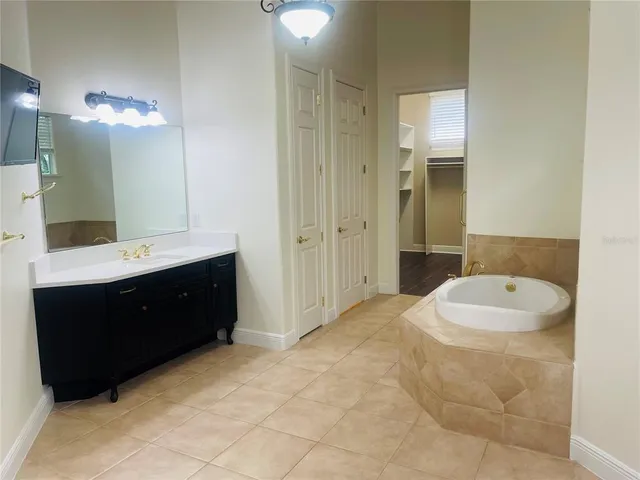 a bathroom with a tub and shower