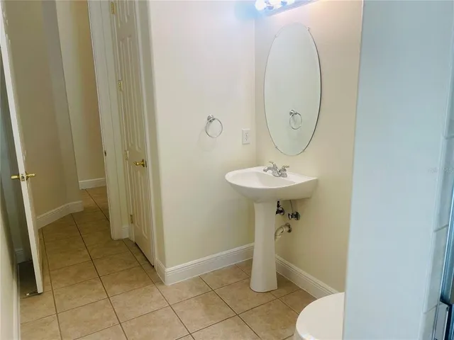 a bathroom with a sink and a window