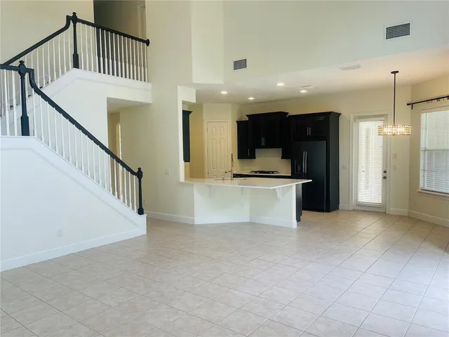 a view of an empty room with windows