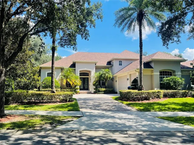 a front view of a house with garden and porch