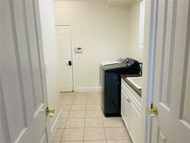 a view of an empty room with glass door