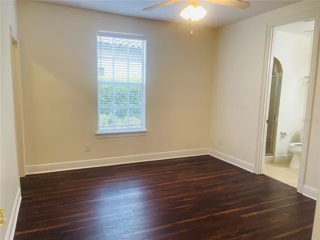 an empty room with wooden floor