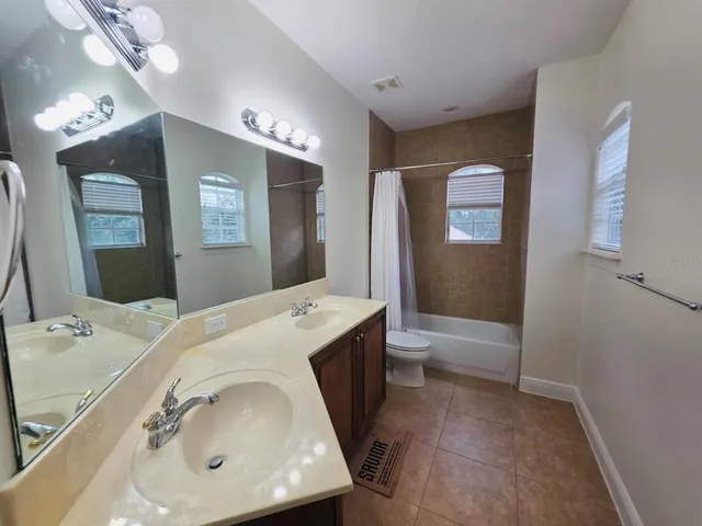 a view of a backyard with swimming pool