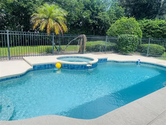 a view of a street with potted plants