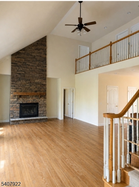 134 Meadows Road Lafayette, NJ 07848 - Photo 6 of 8 a view of an empty room with wooden floor fireplace and a window