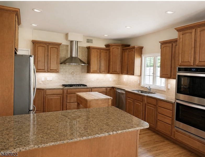134 Meadows Road Lafayette, NJ 07848 - Photo 7 of 8 a kitchen with stainless steel appliances granite countertop a sink stove and refrigerator