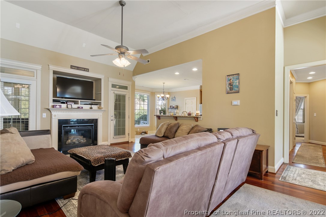 489 Falling Water Road Spring Lake, NC 28390 - Photo 13 of 50 a living room with furniture a fireplace and a flat screen tv