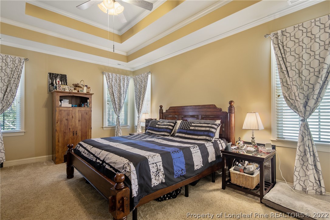 489 Falling Water Road Spring Lake, NC 28390 - Photo 30 of 50 a bedroom with a bed and a window