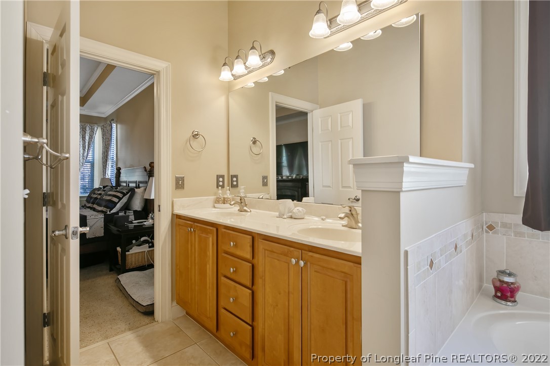 489 Falling Water Road Spring Lake, NC 28390 - Photo 35 of 50 a bathroom with a sink double vanity