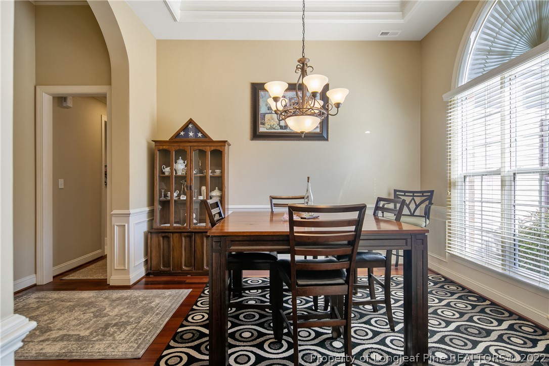 489 Falling Water Road Spring Lake, NC 28390 - Photo 8 of 50 a view of a dining room with furniture window and wooden floor