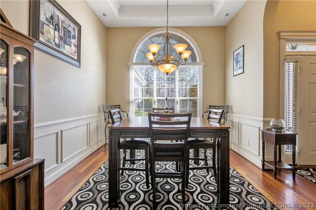 489 Falling Water Road Spring Lake, NC 28390 - Photo 10 of 50 a view of a dining room with furniture window and wooden floor