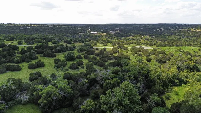an aerial view of residential houses and outdoor space