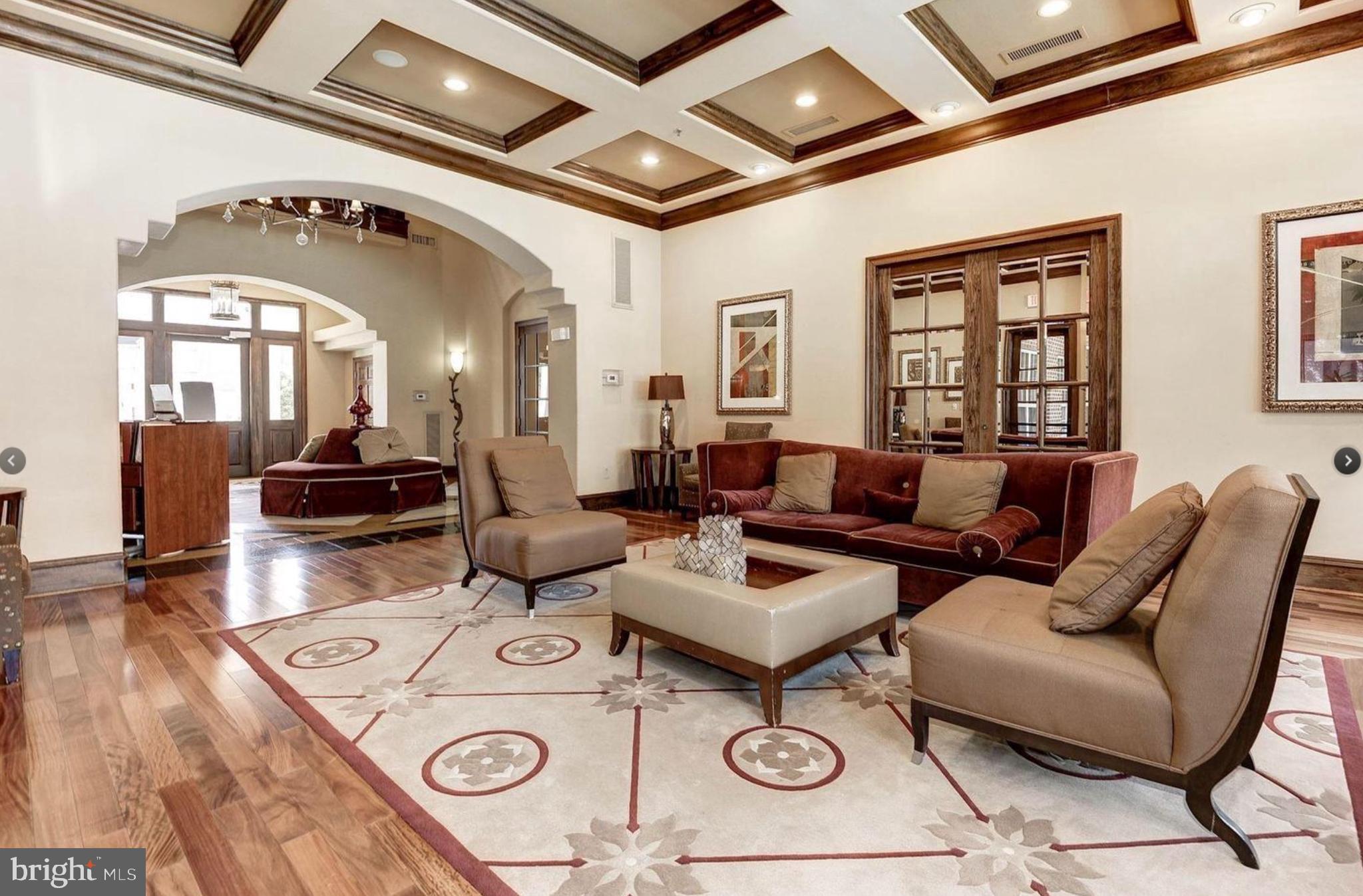 12957 Centre Park Circle, Unit 112 Herndon, VA 20171 - Photo 16 of 25 a living room with furniture and a large window
