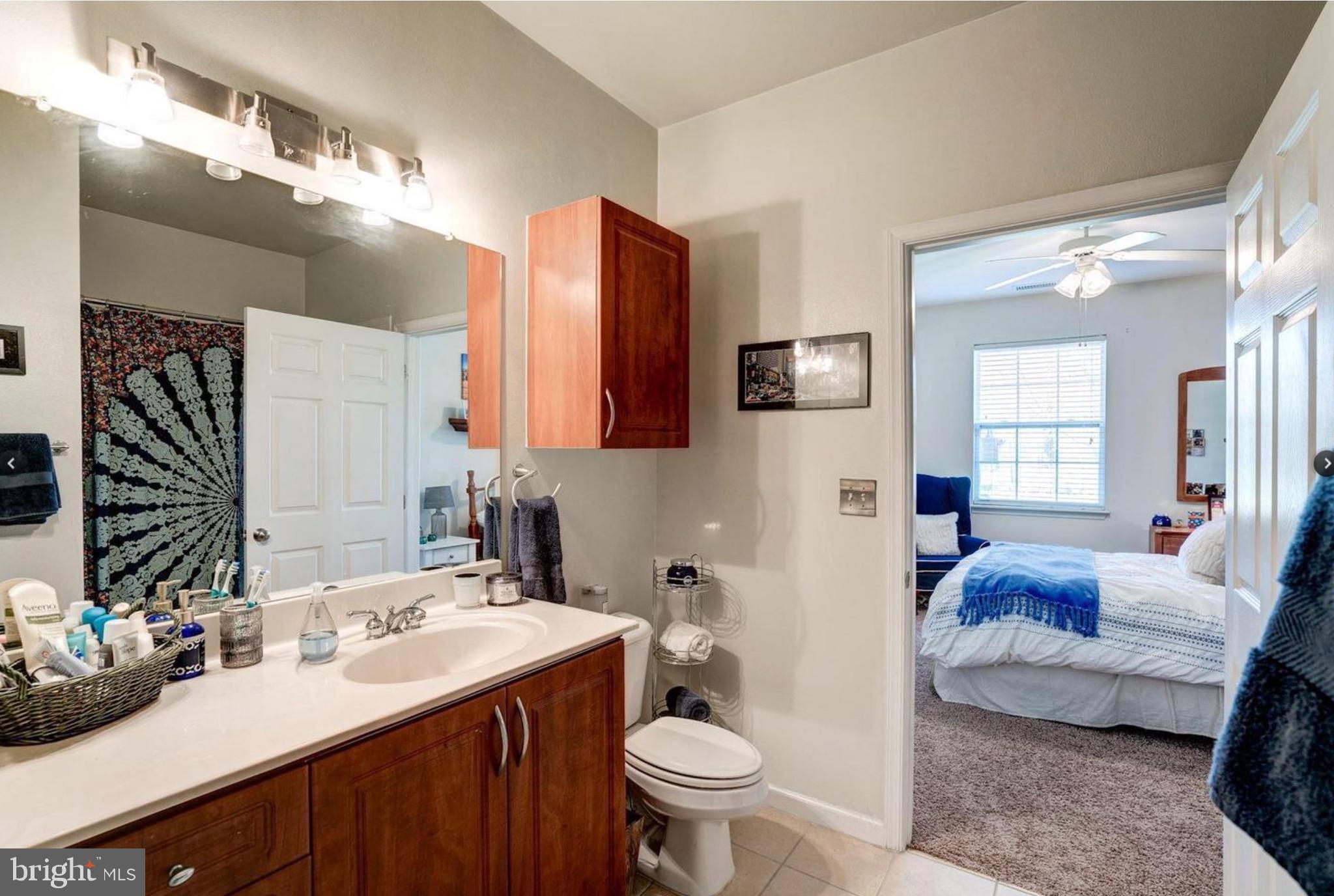 12957 Centre Park Circle, Unit 112 Herndon, VA 20171 - Photo 9 of 25 a bathroom with a sink vanity granite and toilet