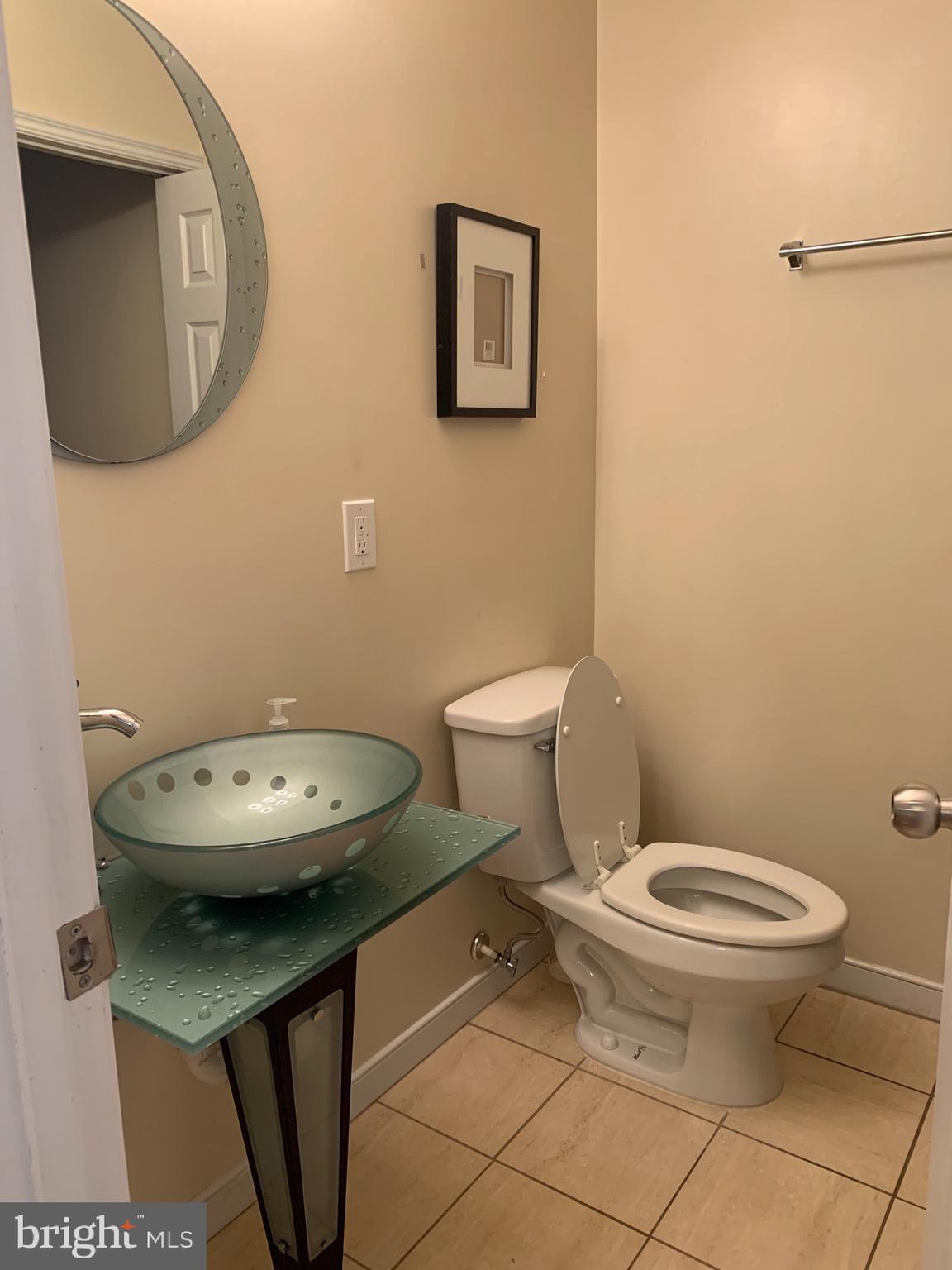 2237 14th Street Southeast Washington, DC 20020 - Photo 15 of 32 a bathroom with a toilet and a sink