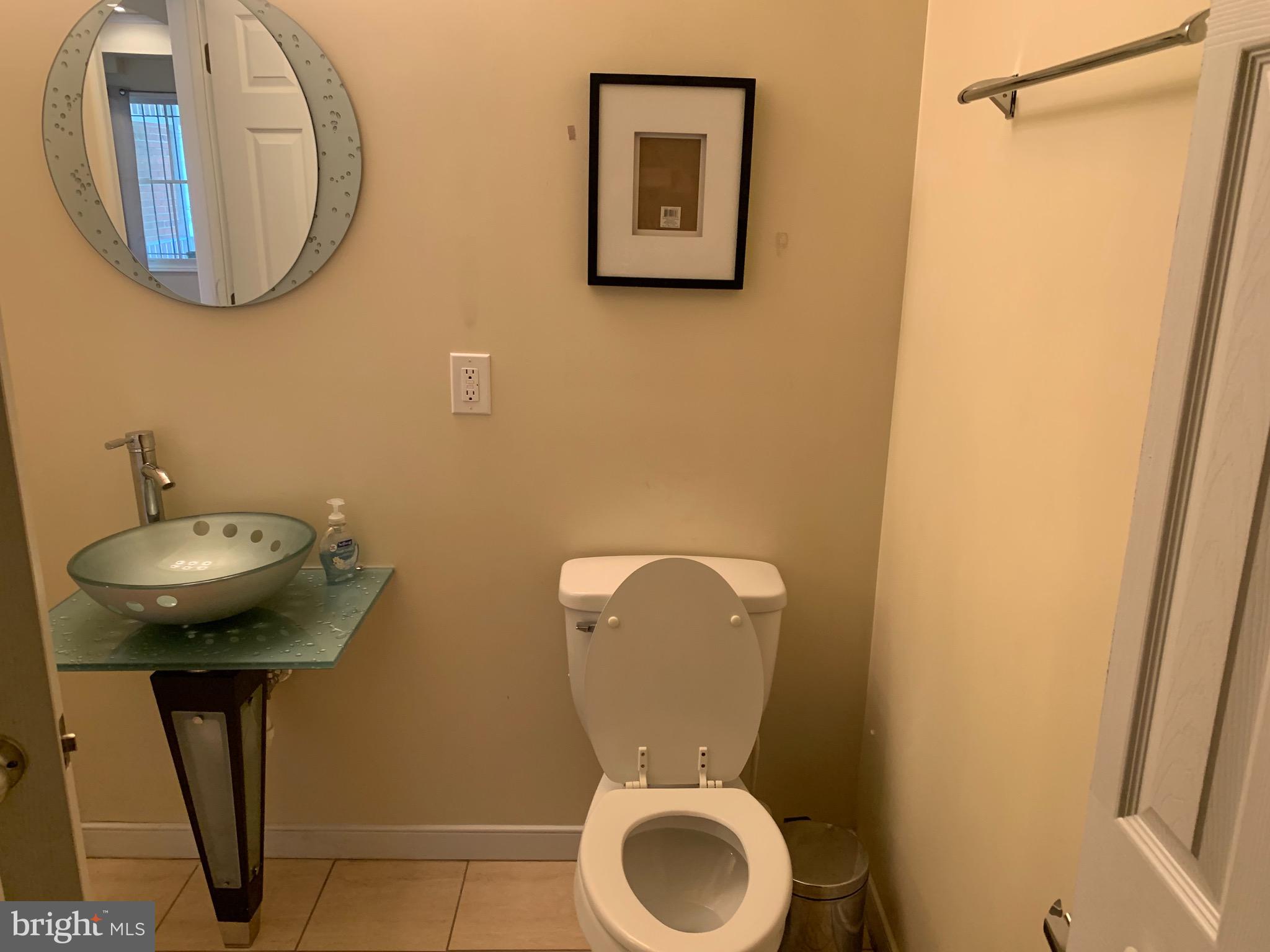 2237 14th Street Southeast Washington, DC 20020 - Photo 16 of 32 a bathroom with a toilet and a sink