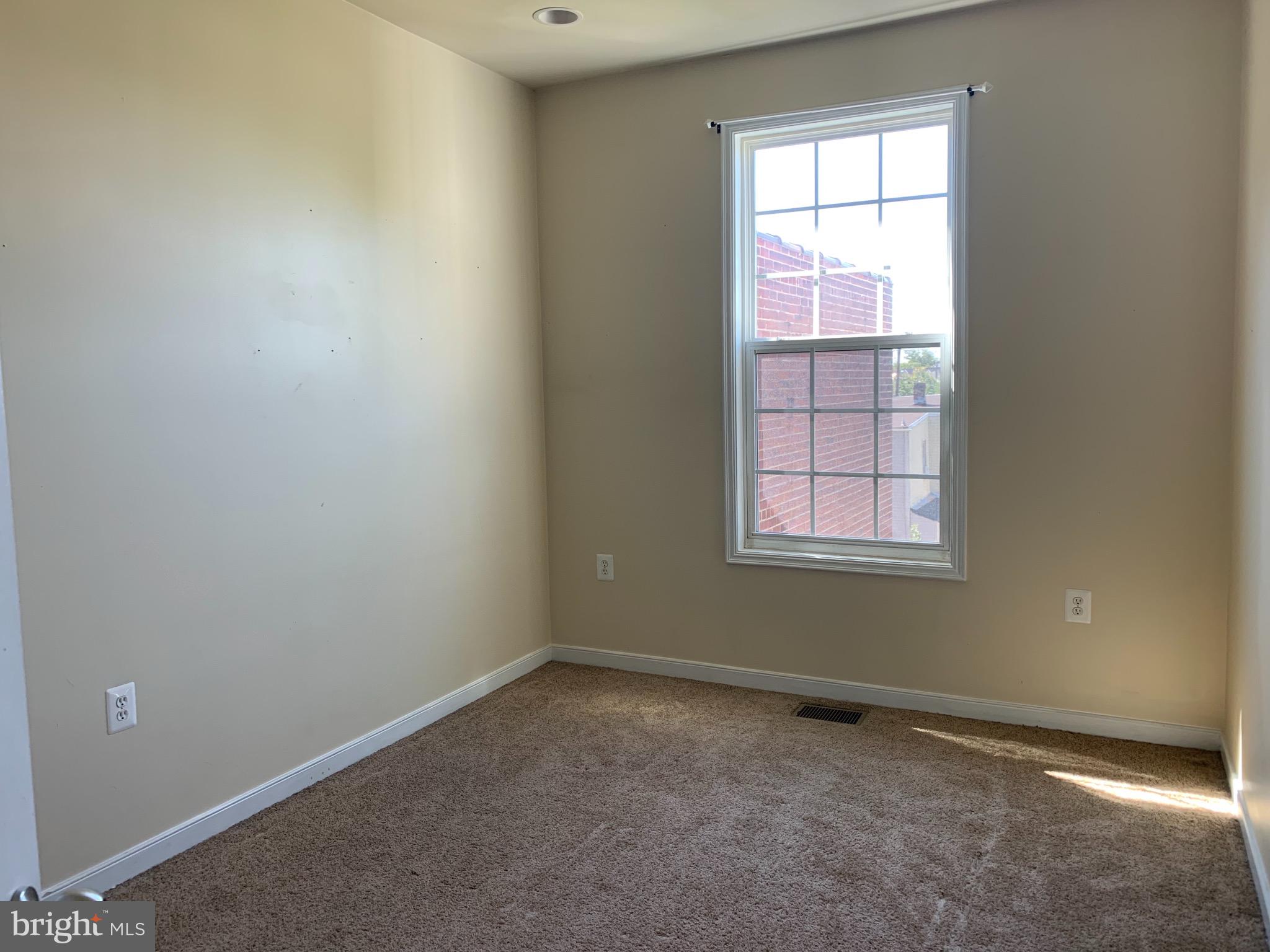2237 14th Street Southeast Washington, DC 20020 - Photo 25 of 32 an empty room with a window