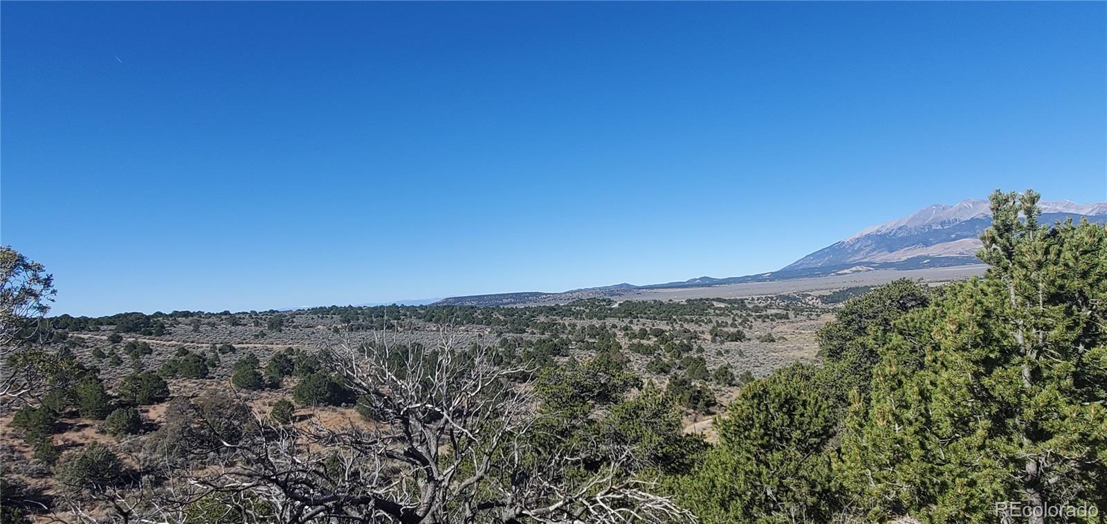 Lot 7356 Bidwell Road Fort Garland, CO 81133 - Photo 13 of 23 a view of a mountain range with trees in the background