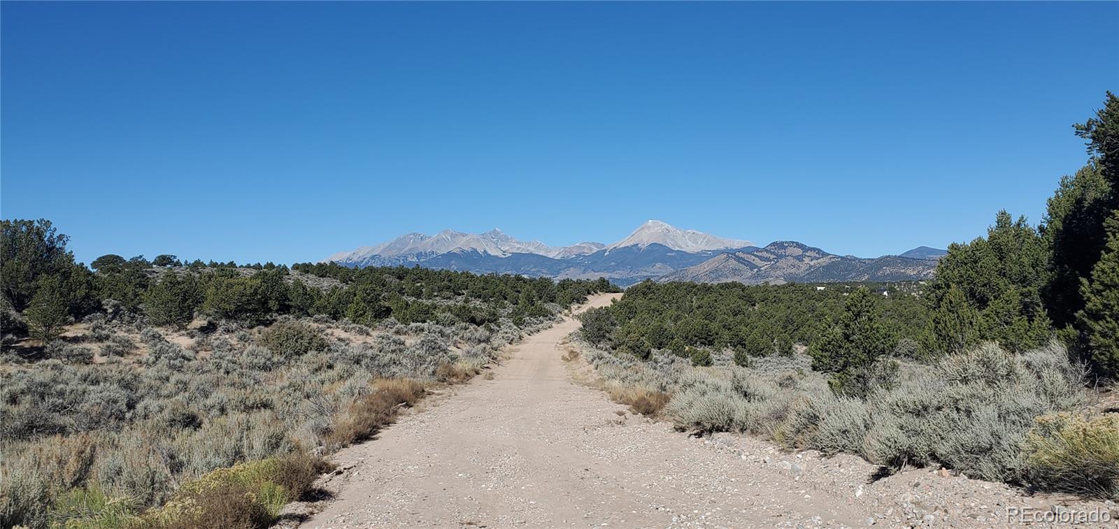 Lot 7356 Bidwell Road Fort Garland, CO 81133 - Photo 22 of 23 a view of a lake with mountains in the background