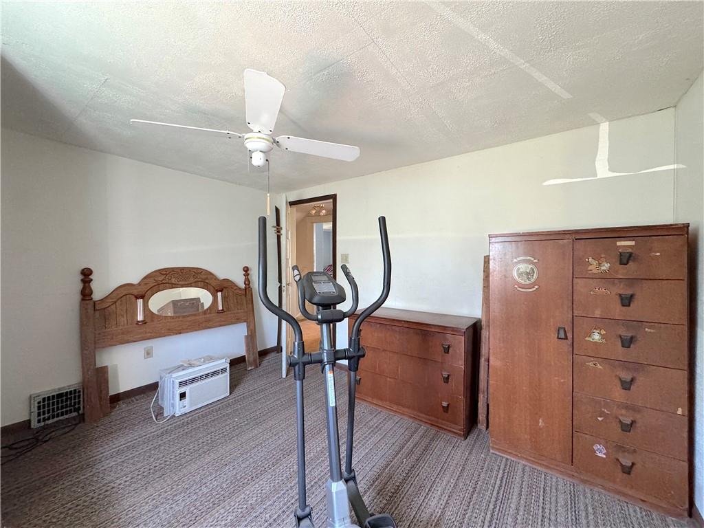 3003 Riverside Drive Claridge, PA 15623 - Photo 24 of 28 a living room with furniture a ceiling fan and a wooden floor