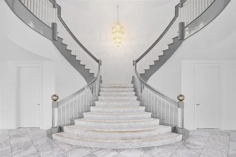 a kitchen with stainless steel appliances granite countertop a sink a counter space and cabinets