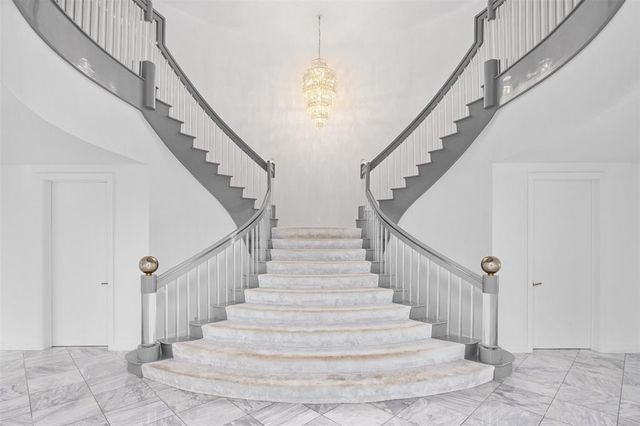 a kitchen with stainless steel appliances granite countertop a sink a counter space and cabinets