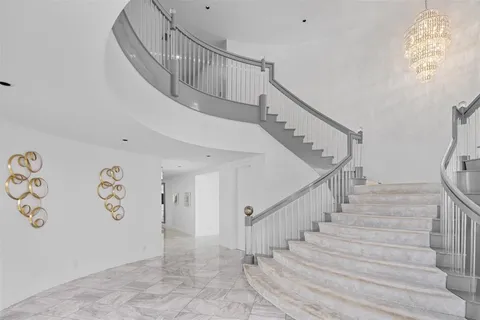 a view of a dining room with furniture and a flat screen tv