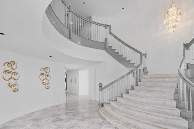 a view of a dining room with furniture and a flat screen tv