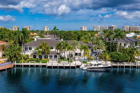 a view of swimming pool with outdoor seating and lake view