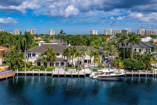 a view of swimming pool with outdoor seating and lake view