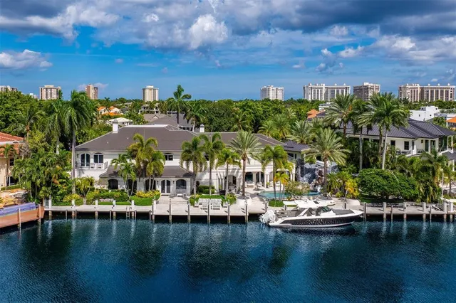 a view of swimming pool with outdoor seating and lake view