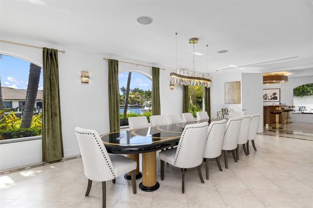 a living room with furniture and a clock