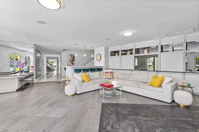 a kitchen with a table and chairs