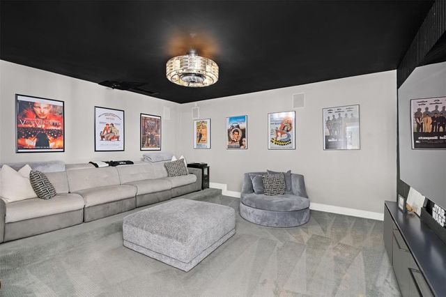 a spacious bedroom with a bed and a couch