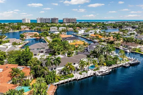 an aerial view of a house with a lake view