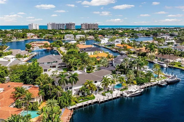 an aerial view of a house with a lake view