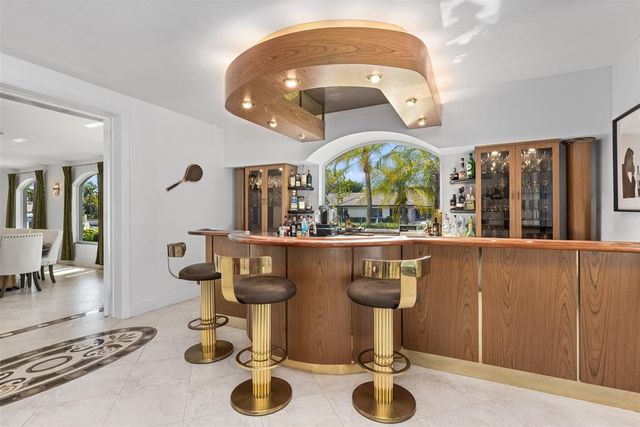 a kitchen with stainless steel appliances granite countertop a refrigerator and a stove