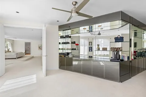 a kitchen with a refrigerator and cabinets