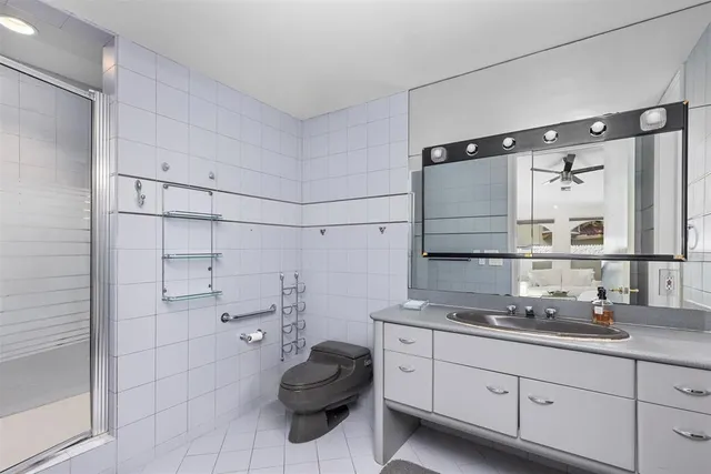 a view of a lake with couches and city view