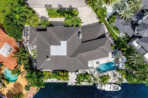 an aerial view of a house with a yard and a garden